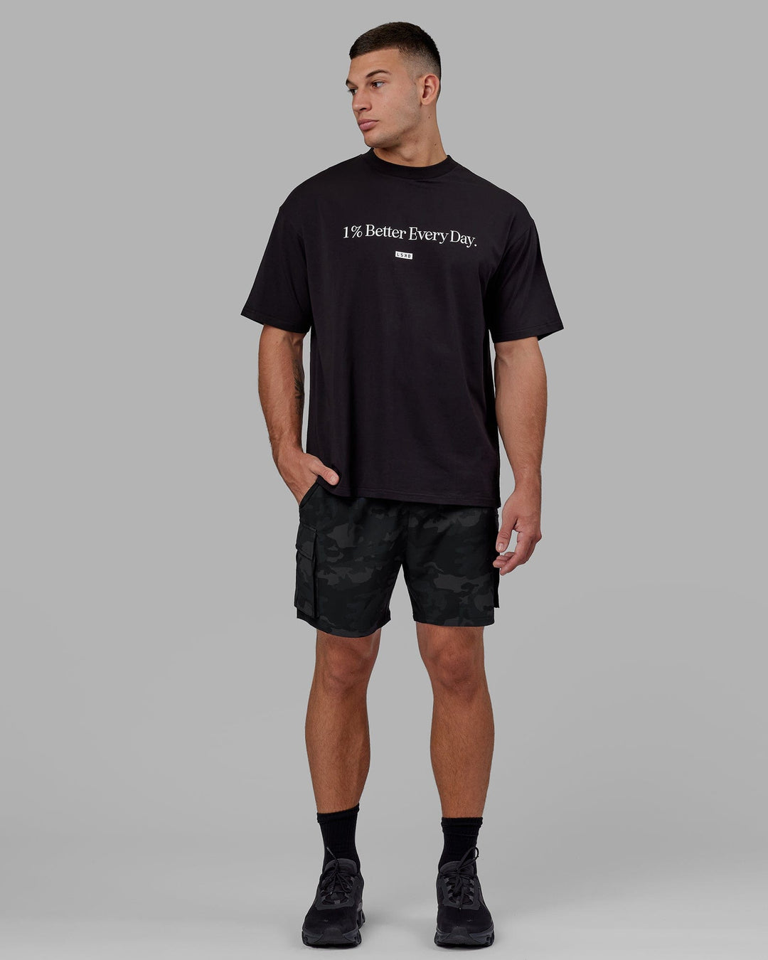Man wearing Unisex 1% Better FLXCotton Tee Oversize - Black
