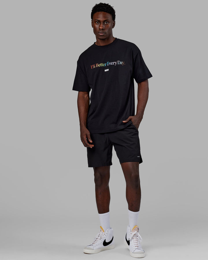 Man wearing Unisex 1% Better FLXCotton Tee Oversize - Pride-Black