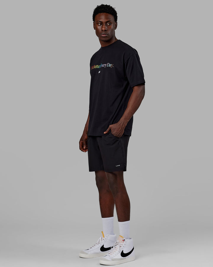 Man wearing Unisex 1% Better FLXCotton Tee Oversize - Pride-Black
