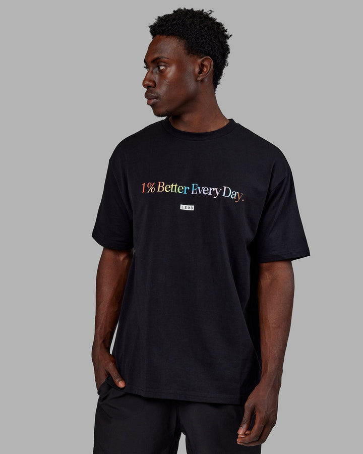 Man wearing Unisex 1% Better FLXCotton Tee Oversize - Pride-Black