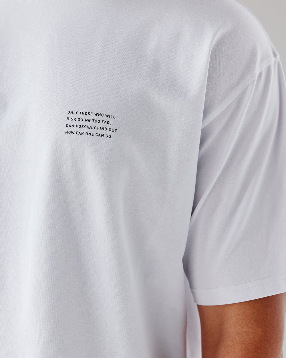 Man wearing Unisex Strive FLXCotton Tee Oversize - White