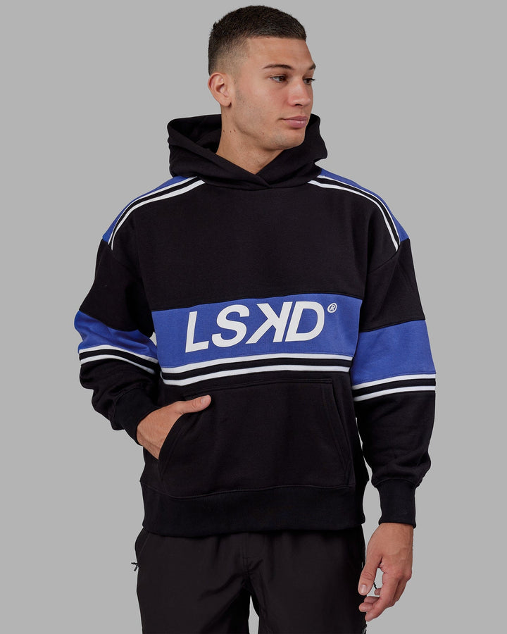 Man wearing Unisex A-Team Hoodie Oversize - Black-Power Cobalt