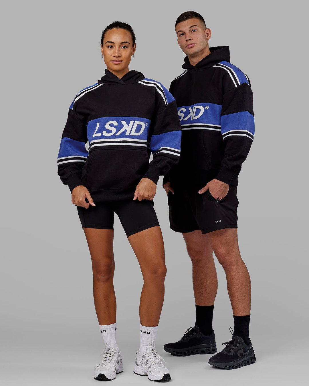 Man and Woman wearing Unisex A-Team Hoodie Oversize - Black-Power Cobalt