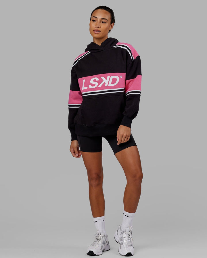 Woman wearing Unisex A-Team Hoodie Oversize - Black-Flamingo