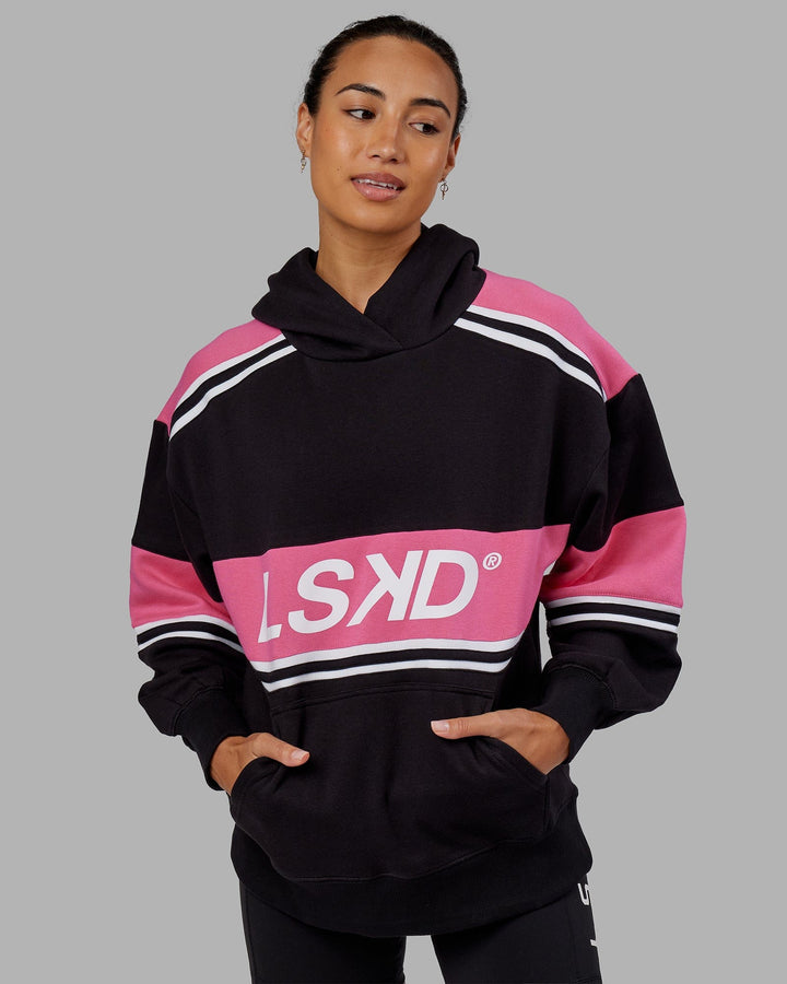 Woman wearing Unisex A-Team Hoodie Oversize - Black-Flamingo