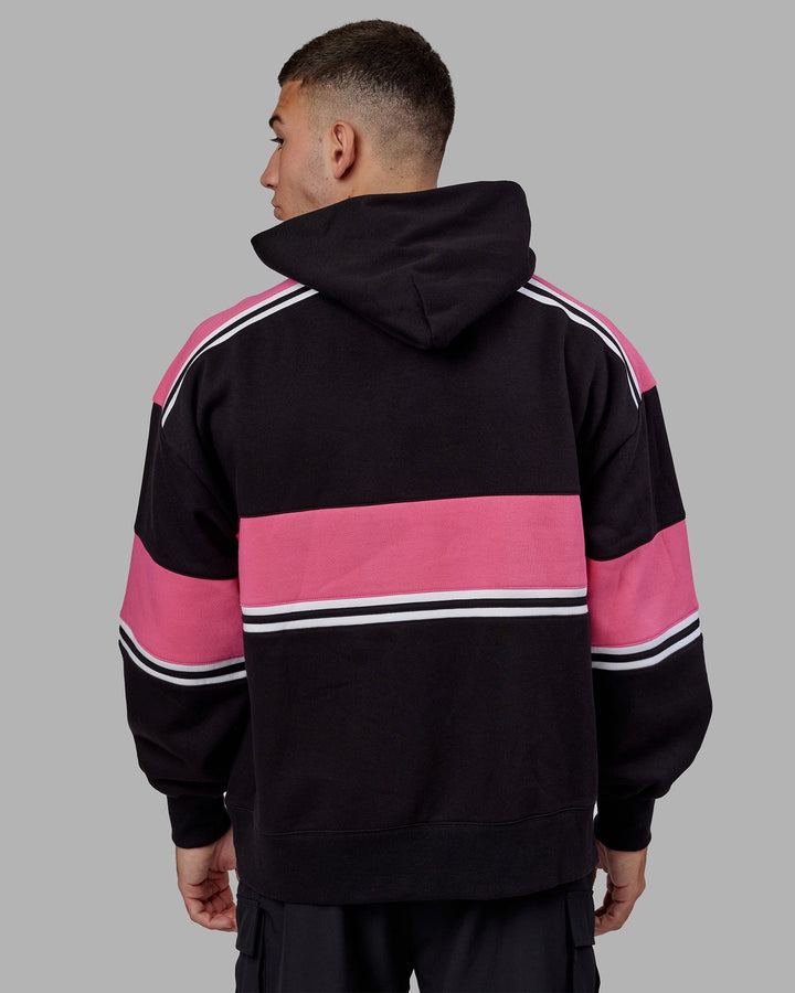 Man wearing Unisex A-Team Hoodie Oversize - Black-Flamingo