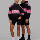 Man and Woman wearing Unisex A-Team Hoodie Oversize - Black-Flamingo