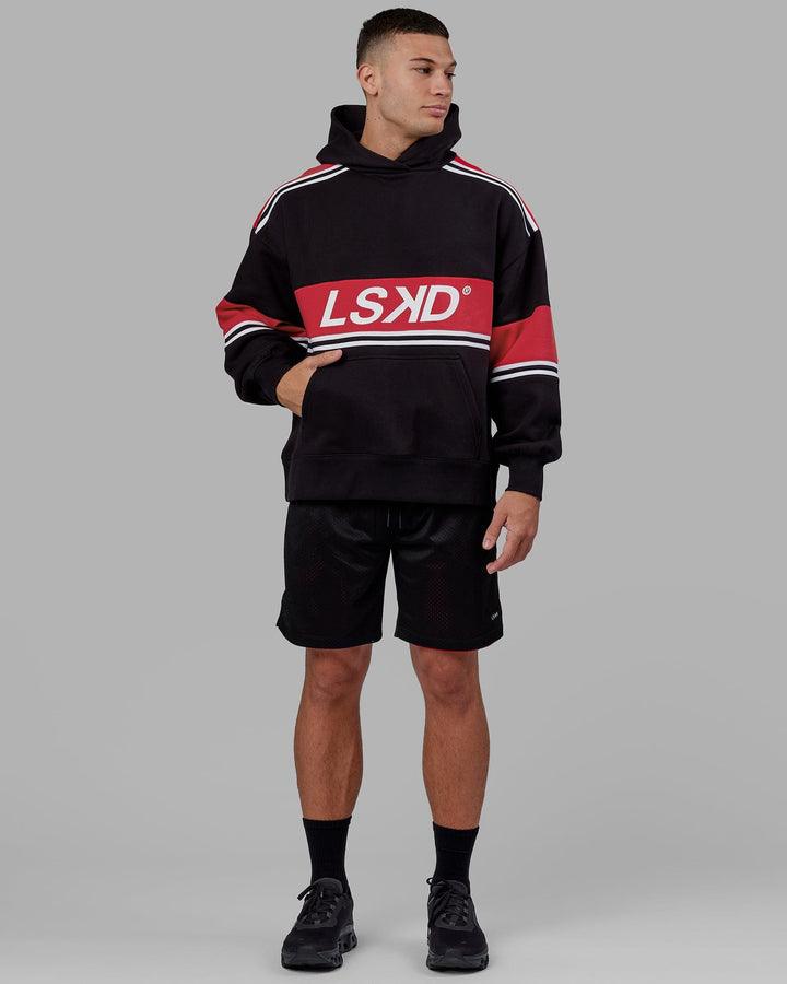 Man wearing Unisex A-Team Hoodie Oversize - Black-Scarlet