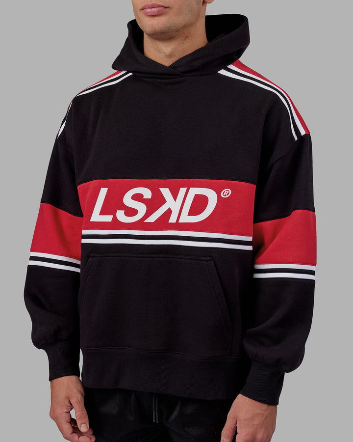 Man wearing Unisex A-Team Hoodie Oversize - Black-Scarlet