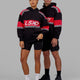 Man and Woman wearing Unisex A-Team Hoodie Oversize - Black-Scarlet