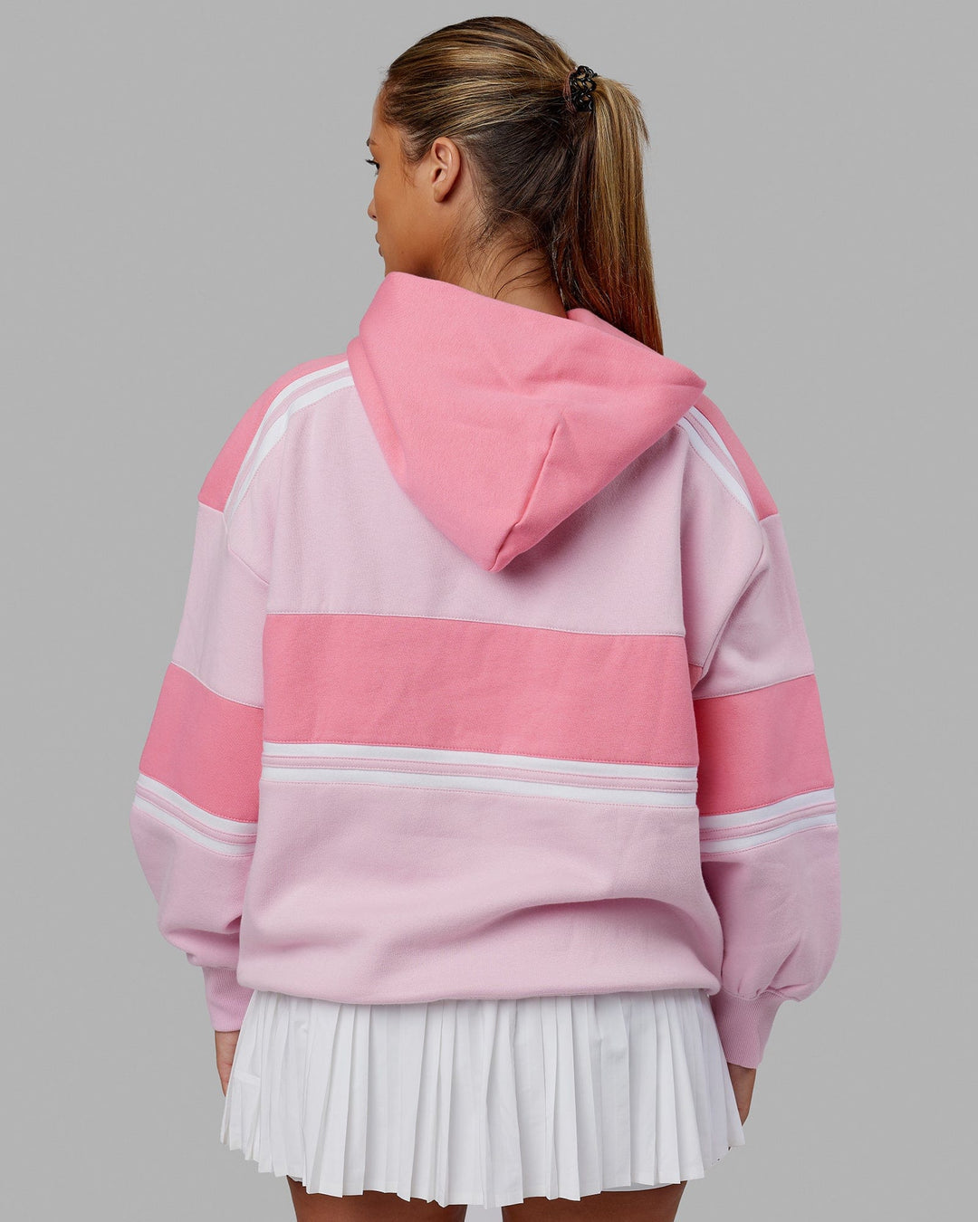 Woman wearing Unisex A-Team Hoodie Oversize - Petal Pink-Peony Pink