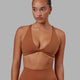 Woman wearing Agile Sports Bra - Hazel