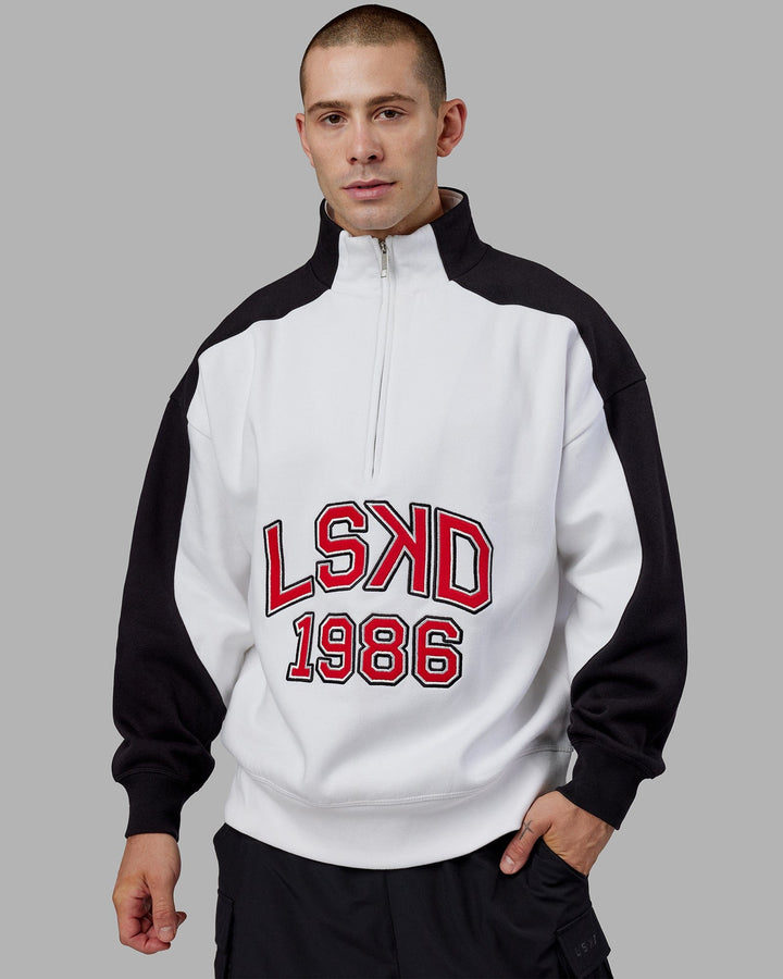 Man wearing Unisex Alumni 1/4 Zip Sweater Oversize - White-Scarlet