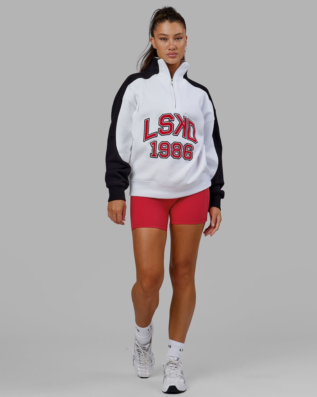 Woman wearing Unisex Alumni 1/4 Zip Sweater Oversize - White-Scarlet