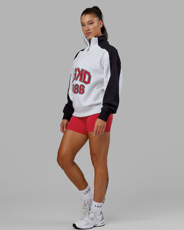 Woman wearing Unisex Alumni 1/4 Zip Sweater Oversize - White-Scarlet