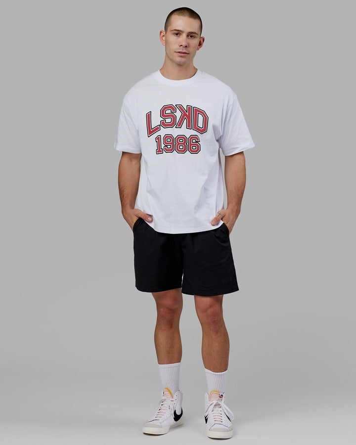 Man wearing Unisex Alumni Heavyweight Tee Oversize - White-Red