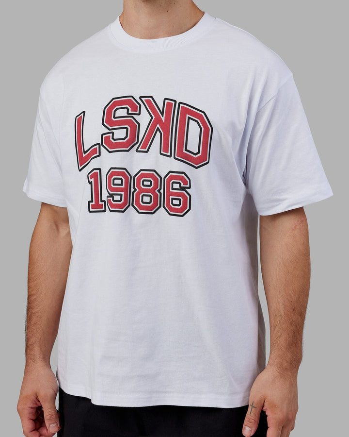 Man wearing Unisex Alumni Heavyweight Tee Oversize - White-Red