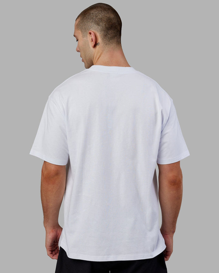 Man wearing Unisex Alumni Heavyweight Tee Oversize - White-Red