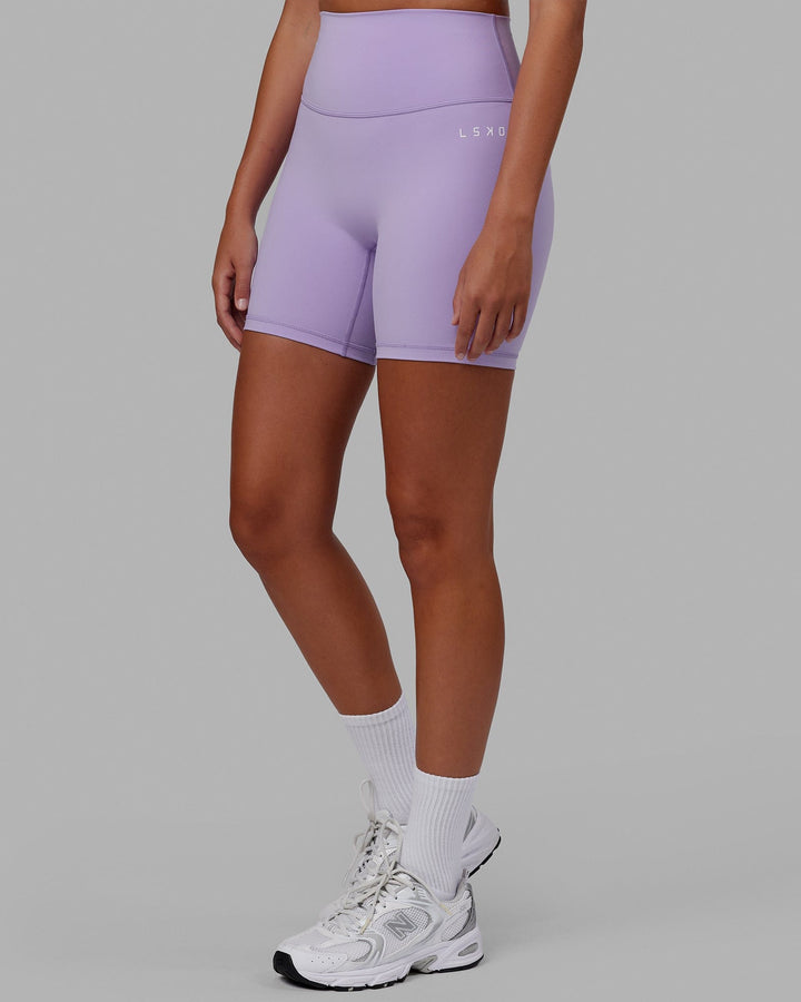Woman wearing Base 2.0 Mid Short Tight - Pale Lilac