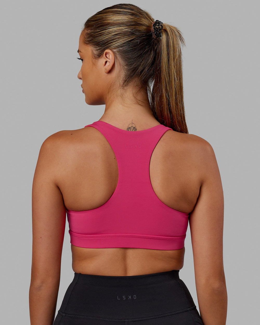 Woman wearing Base Sports Bra - Azalia Pink