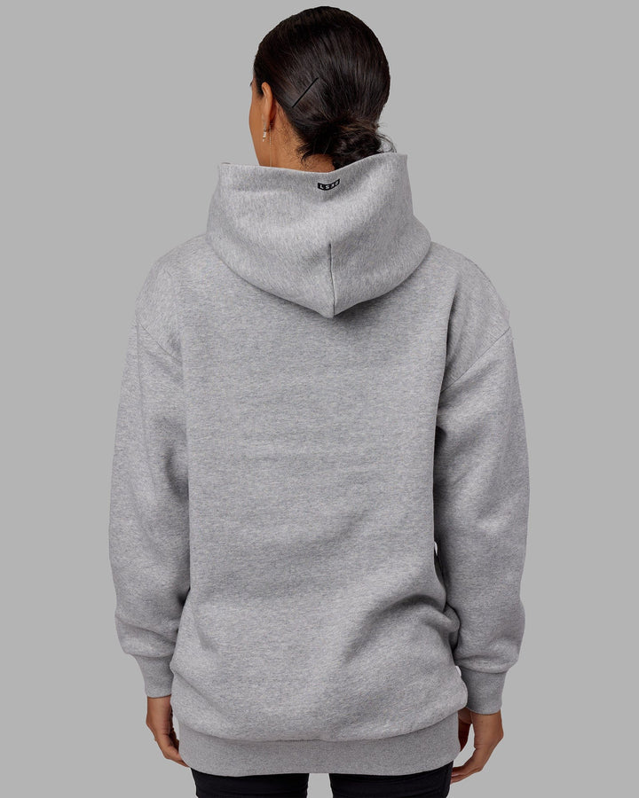 Woman wearing Unisex Capsule Hoodie Oversize - Lt Grey Marl
