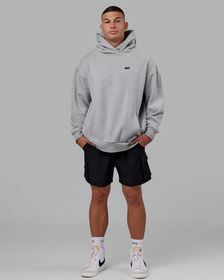 Man wearing Unisex Capsule Hoodie Oversize - Lt Grey Marl