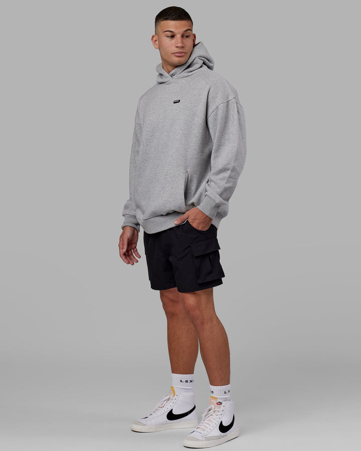 Man wearing Unisex Capsule Hoodie Oversize - Lt Grey Marl