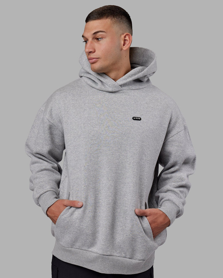 Man wearing Unisex Capsule Hoodie Oversize - Lt Grey Marl