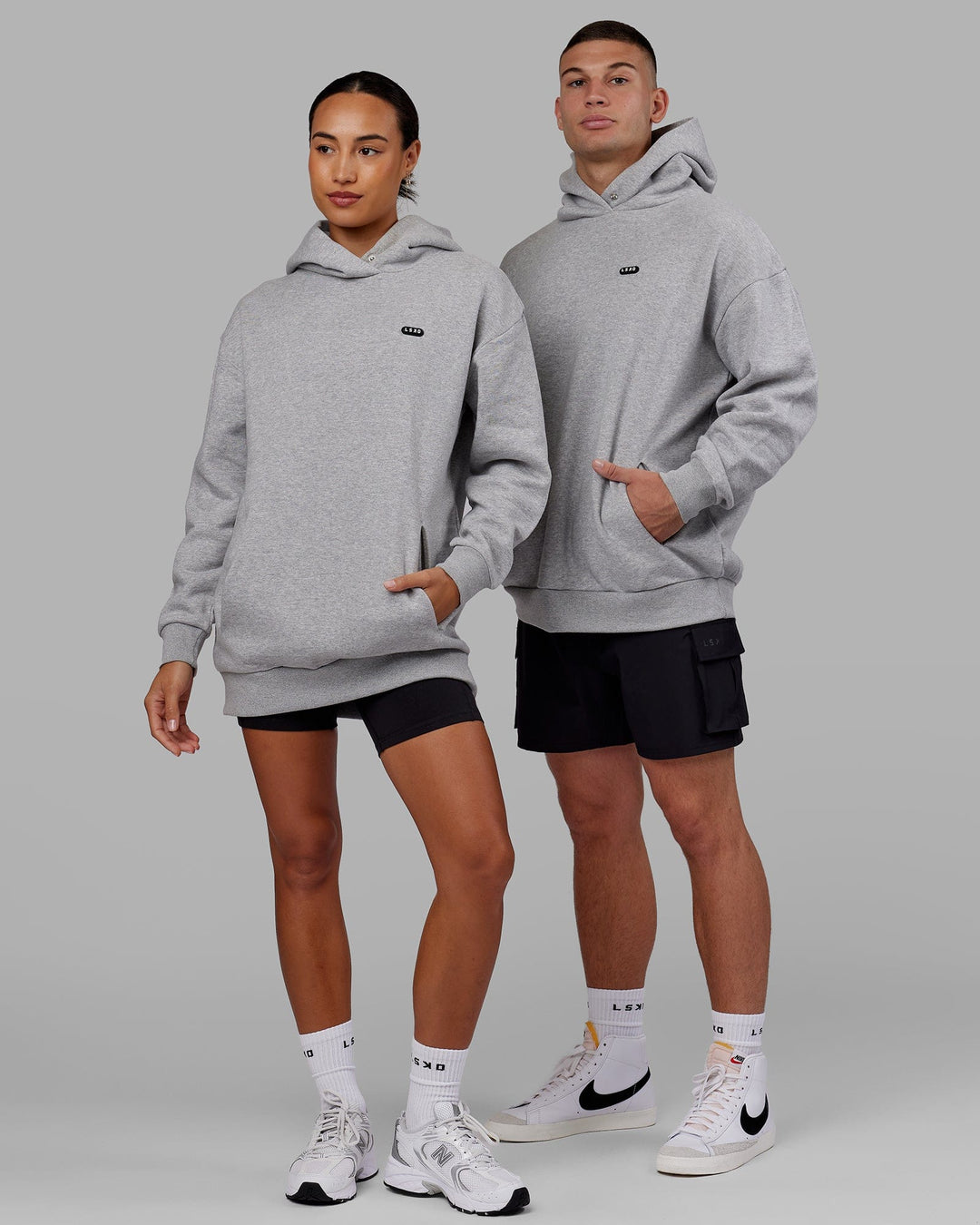 Man and Woman wearing Unisex Capsule Hoodie Oversize - Lt Grey Marl