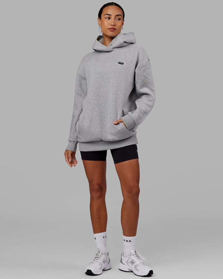 Woman wearing Unisex Capsule Hoodie Oversize - Lt Grey Marl