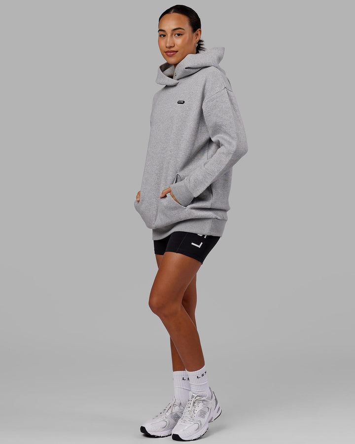 Woman wearing Unisex Capsule Hoodie Oversize - Lt Grey Marl