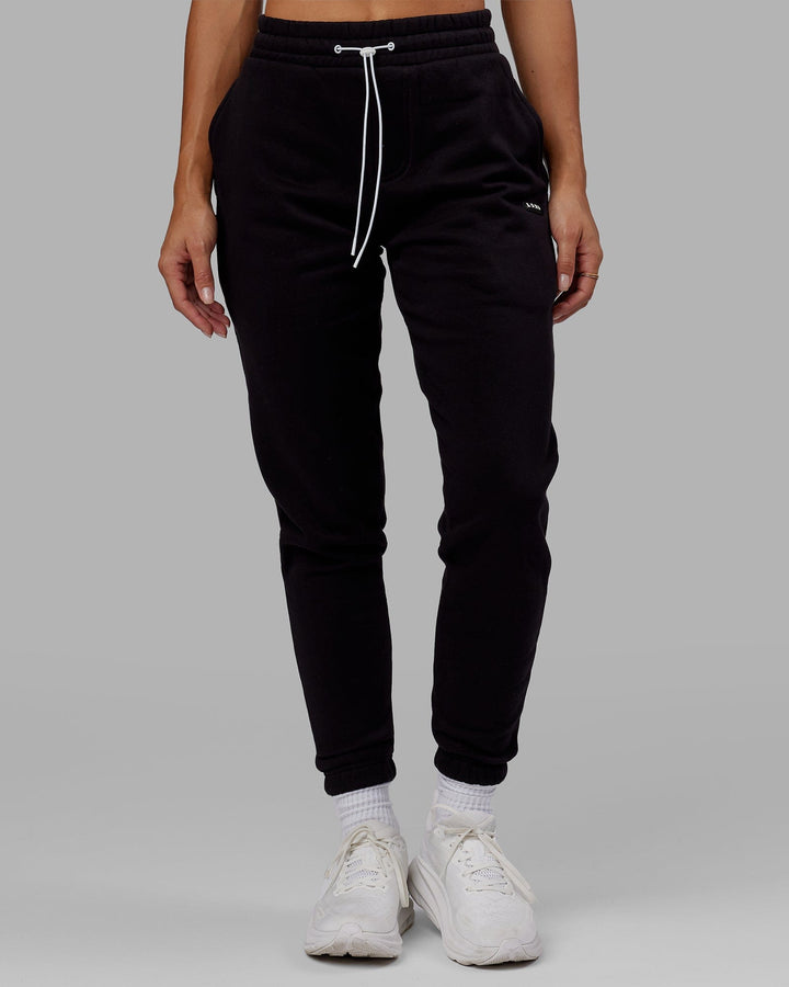 Woman wearing Unisex Capsule Track Pant - Black