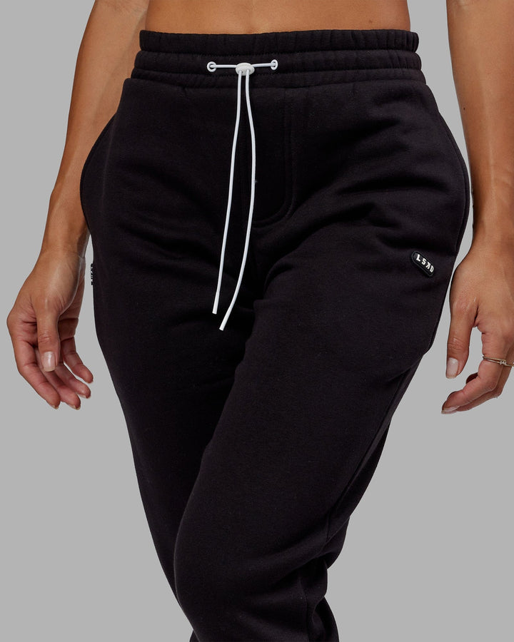 Woman wearing Unisex Capsule Track Pant - Black