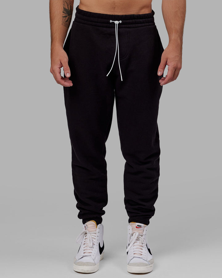 Man wearing Unisex Capsule Track Pant - Black