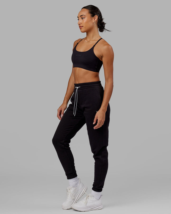 Woman wearing Unisex Capsule Track Pant - Black