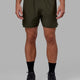 Man wearing Challenger 6" Performance Short with Liner - Forest Night