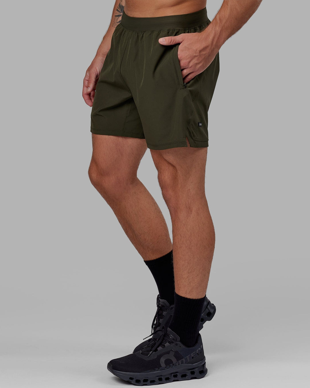 Man wearing Challenger 6" Performance Short with Liner - Forest Night