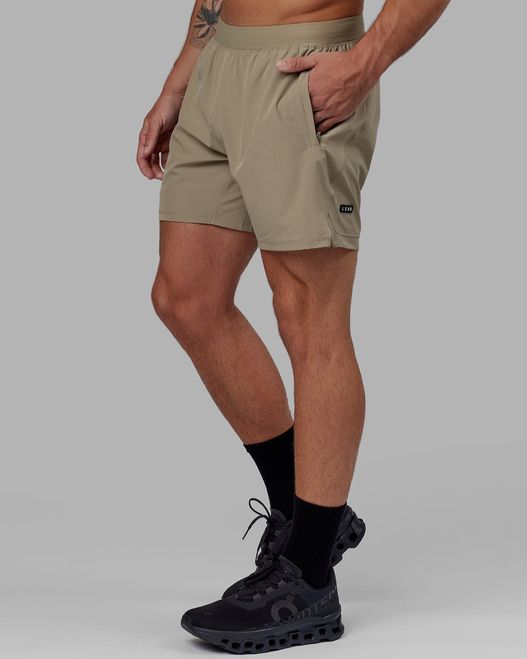 Man wearing Challenger 6" Performance Short Linerless - Laurel Oak