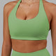 Woman wearing Challenger Sports Bra - Apple Mint