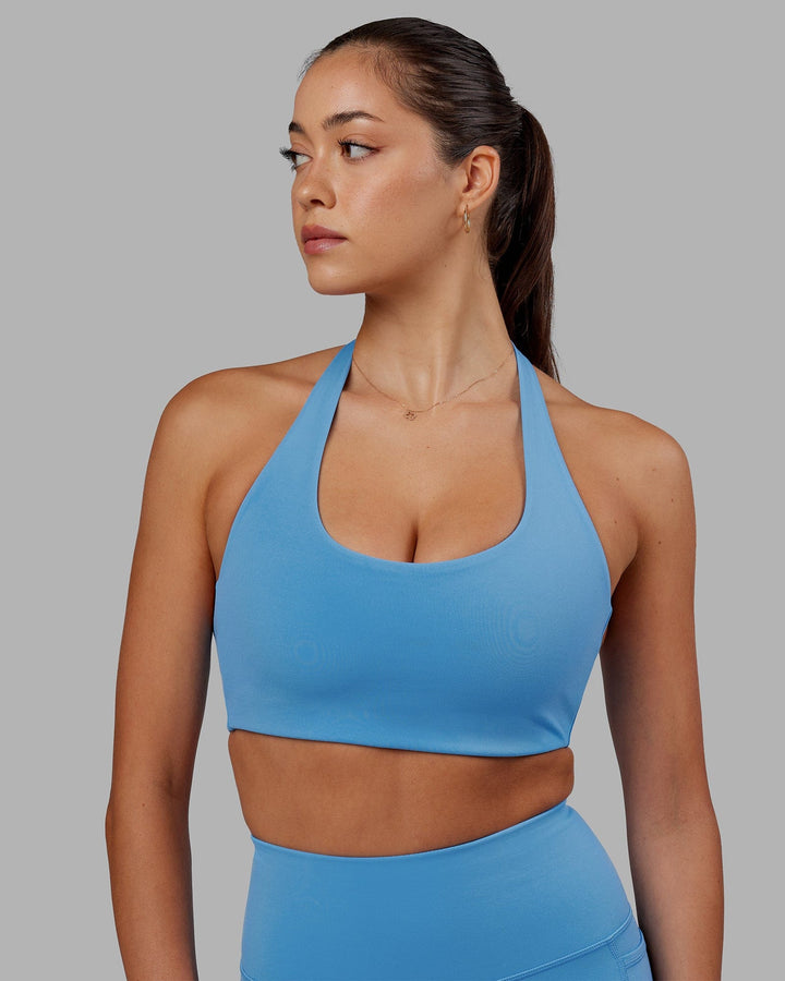 Woman wearing Challenger Sports Bra - Azure Blue