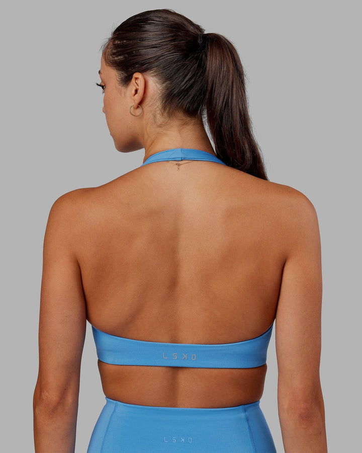Woman wearing Challenger Sports Bra - Azure Blue