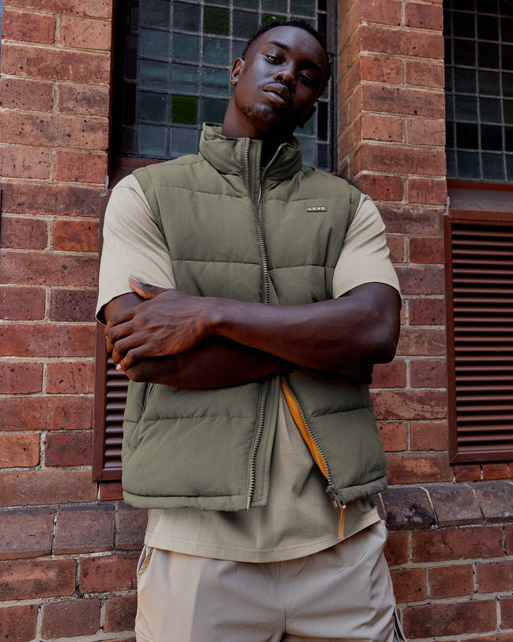 Man wearing Classic Puffer Vest - Tealeaf