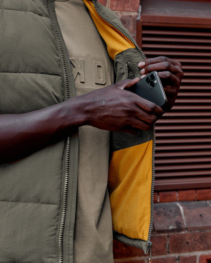 Man wearing Classic Puffer Vest - Tealeaf