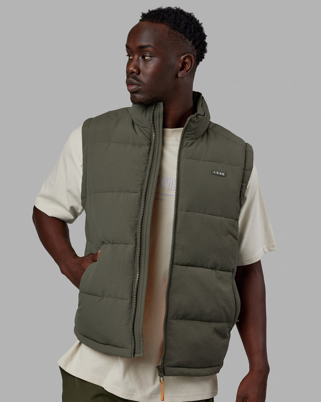 Man wearing Classic Puffer Vest - Tealeaf