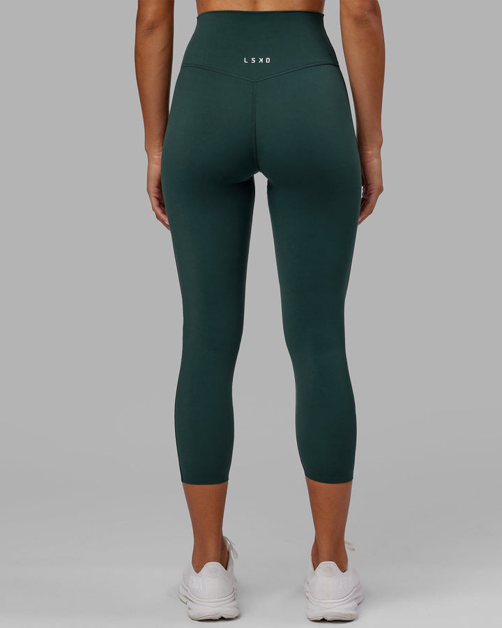 Woman wearing Elixir 7/8 Length Tight - Vital Green