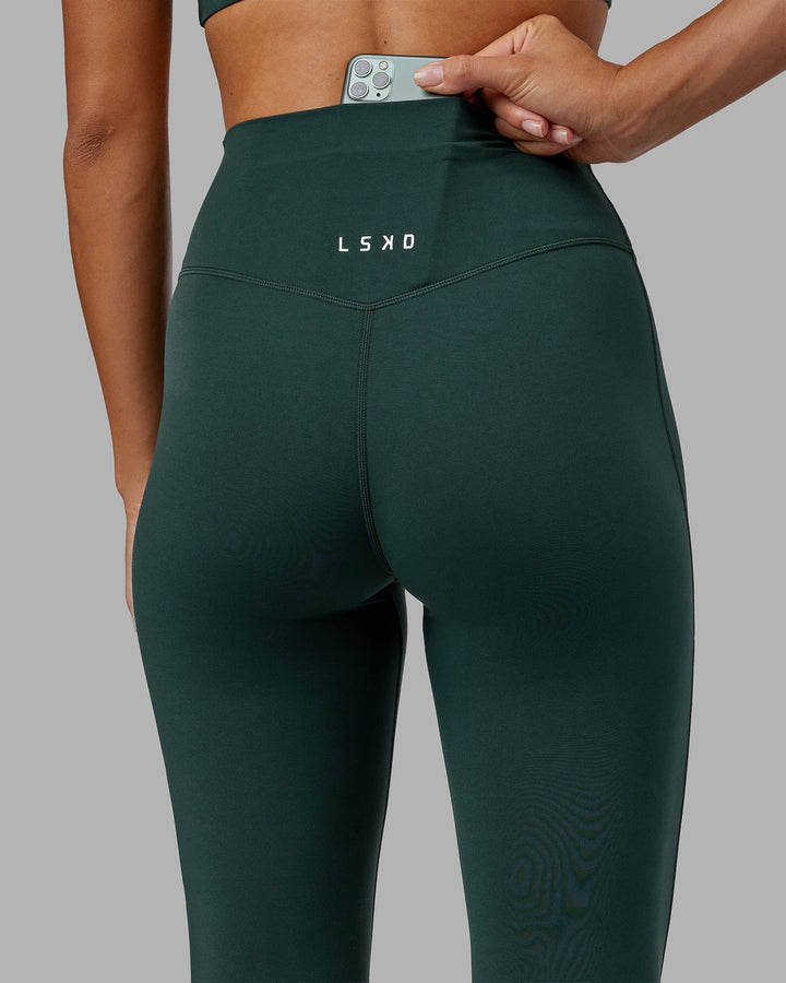 Woman wearing Elixir 7/8 Length Tight - Vital Green