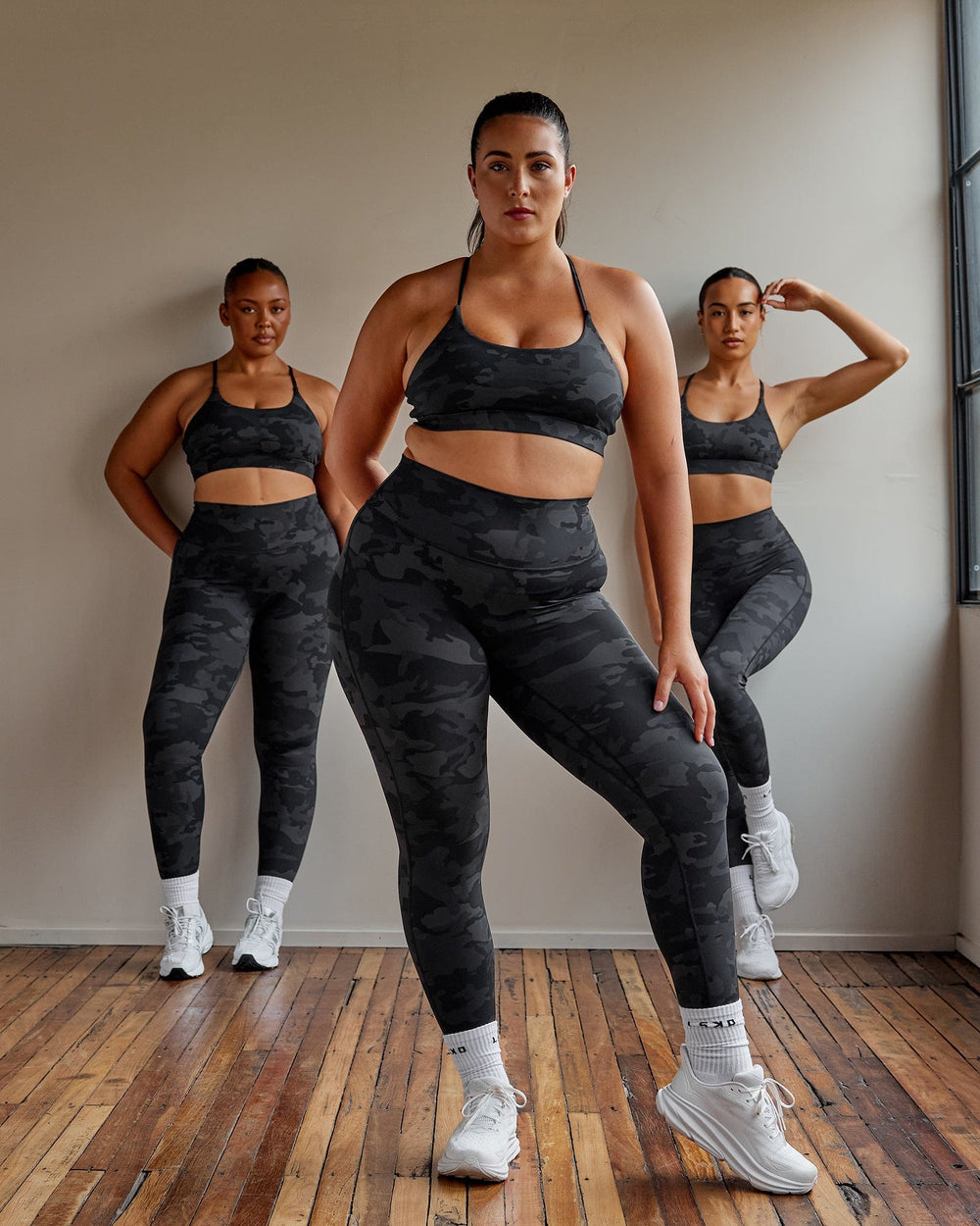 Woman wearing Elixir Full Length Tight - Black Camo