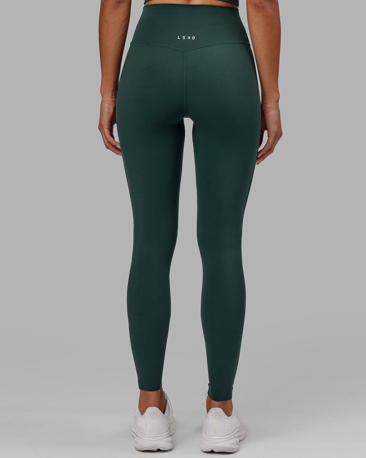 Woman wearing Elixir Full Length Tight - Vital Green