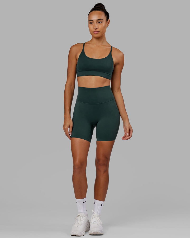 Woman wearing Elixir Sports Bra - Vital Green