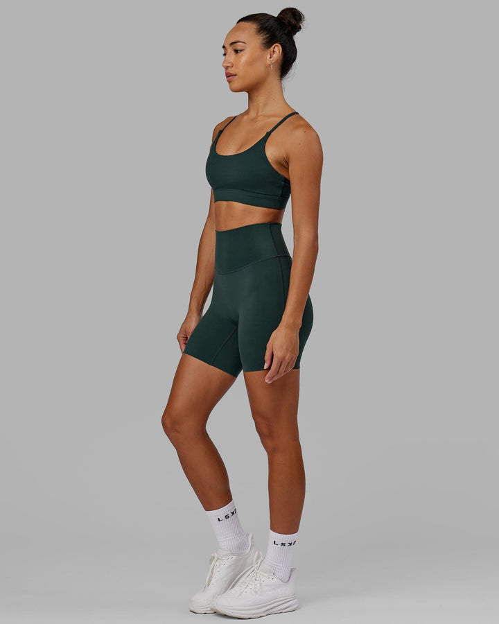 Woman wearing Elixir Sports Bra - Vital Green